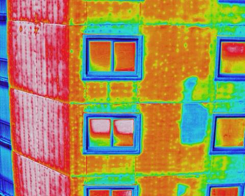 Radiometric thermal image of a building facade showing window and wall temperature differences